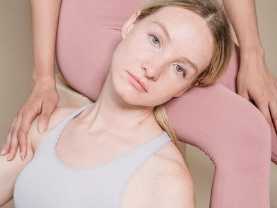 Silhouette of a person moving gracefully between two exercise positions.